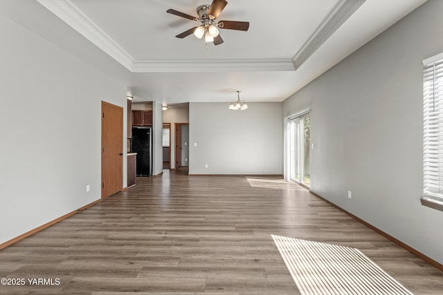 3101 Swan Ave, Yakima, WA 98902 - spare room with a tray ceiling, ornamental molding, ceiling fan, a chandelier, and wood finished floors