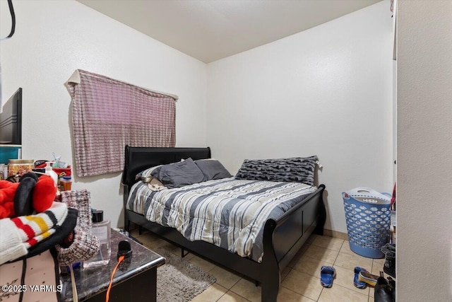 bedroom with tile patterned floors