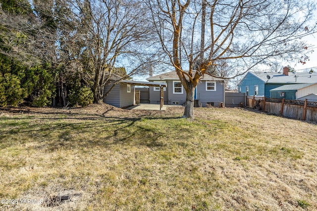 view of yard featuring fence and a patio