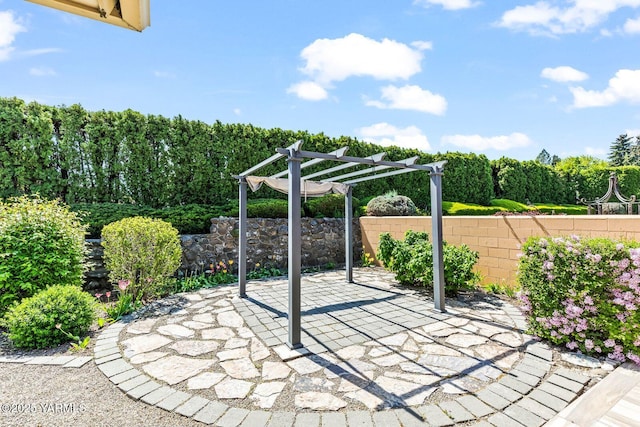view of patio with fence and a pergola