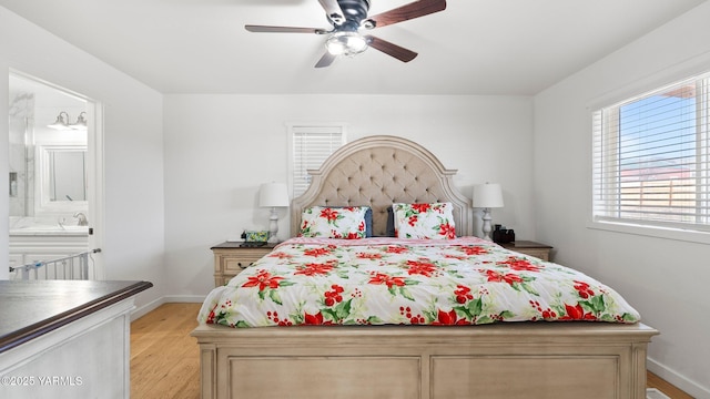471 Gibson Rd, Selah, WA 98942 - bedroom with light wood-style flooring, baseboards, ensuite bathroom, and a ceiling fan
