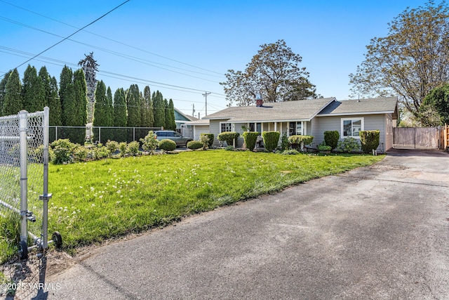1510 Hathaway St, Yakima, WA 98902 - ranch-style home with a gate, a front lawn, fence, and a chimney