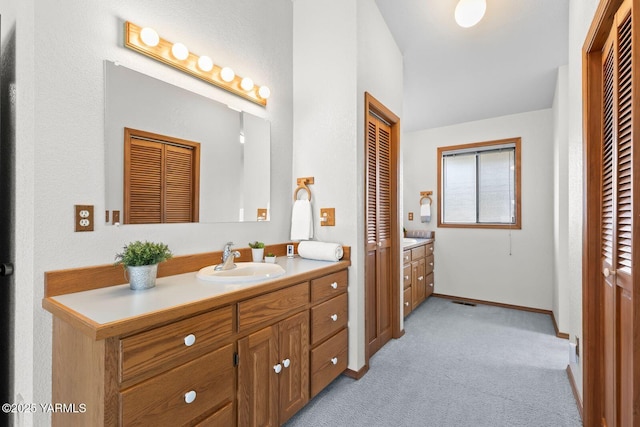 41 Alteejen Rd, Zillah, WA 98953 - bathroom featuring vanity, carpet, baseboards, and a closet