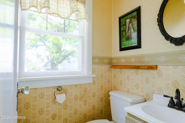 418 S 32nd Ave, Yakima, WA 98902 - bathroom featuring wallpapered walls, toilet, and vanity