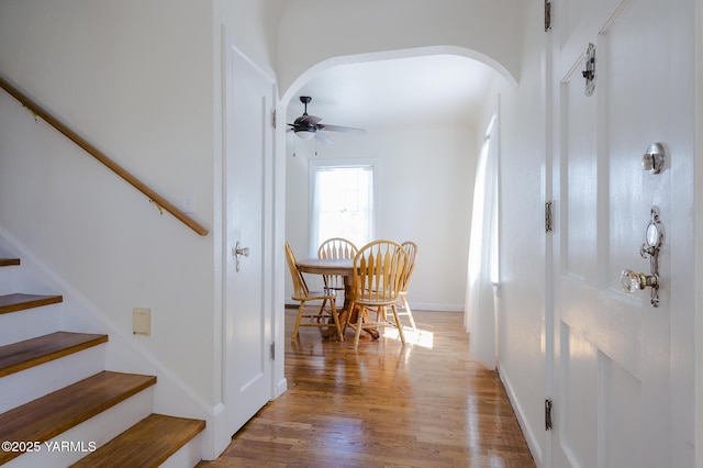 418 S 32nd Ave, Yakima, WA 98902 - entrance foyer with arched walkways, a ceiling fan, wood finished floors, stairway, and baseboards