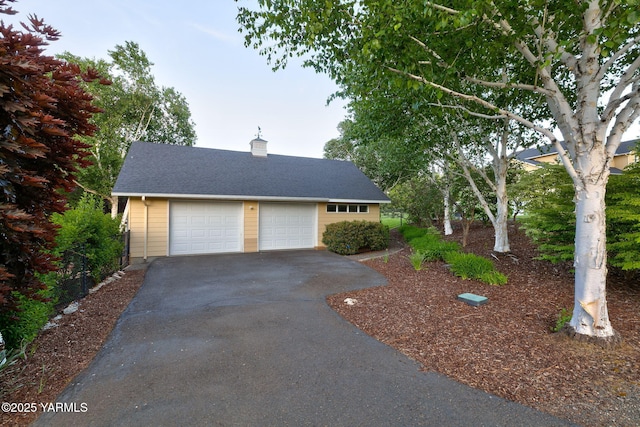 1011 N 79th Ave, Yakima, WA 98908 - view of front of house featuring a chimney, a garage, and a shingled roof
