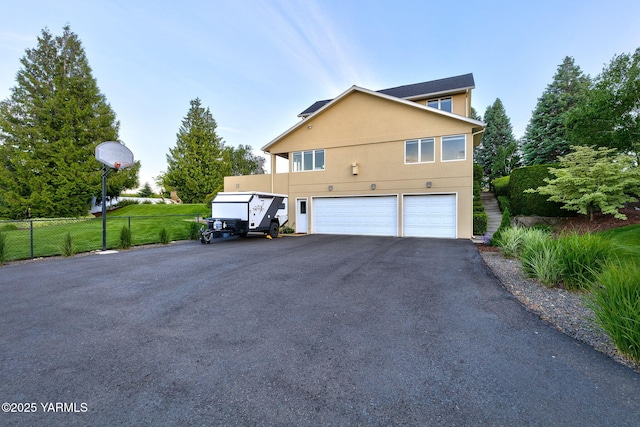 1011 N 79th Ave, Yakima, WA 98908 - view of side of property with a garage and driveway