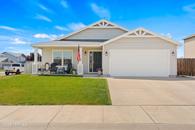 212 Golding St, Moxee, WA 98936 - view of front of home with covered porch, concrete driveway, a garage, and a shingled roof
