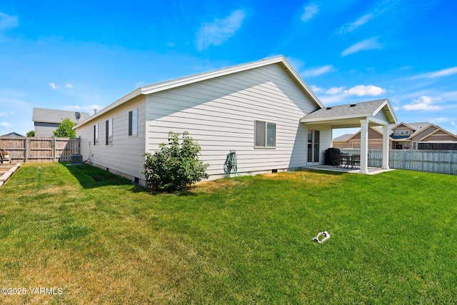 212 Golding St, Moxee, WA 98936 - rear view of house with a fenced backyard, a patio area, and crawl space