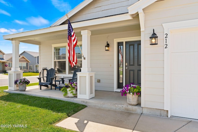 212 Golding St, Moxee, WA 98936 - view of exterior entry featuring covered porch and a lawn
