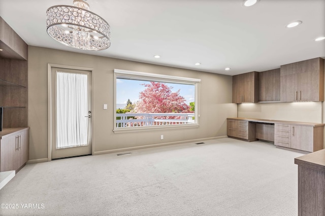 5902 Glacier Way, Yakima, WA 98908 - unfurnished office with light colored carpet, baseboards, built in desk, and recessed lighting