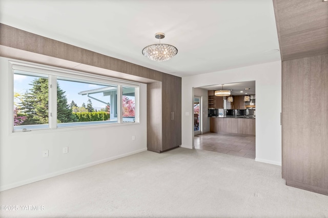 5902 Glacier Way, Yakima, WA 98908 - unfurnished room with a chandelier, light colored carpet, and baseboards