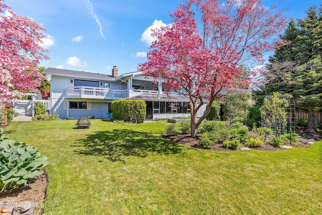5902 Glacier Way, Yakima, WA 98908 - rear view of property with a chimney and an outdoor fire pit