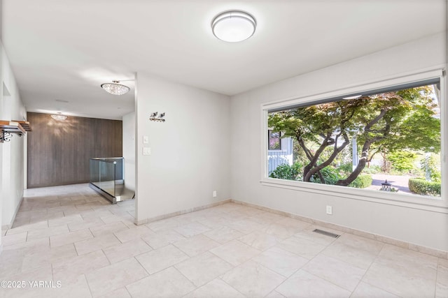 5902 Glacier Way, Yakima, WA 98908 - spare room with plenty of natural light, wooden walls, and baseboards