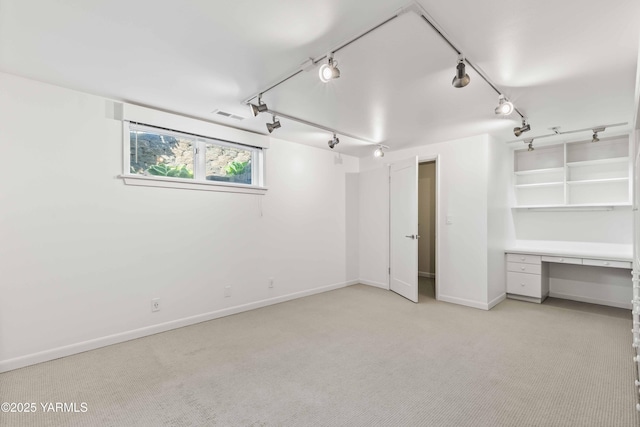 5902 Glacier Way, Yakima, WA 98908 - unfurnished bedroom featuring light carpet, rail lighting, and baseboards