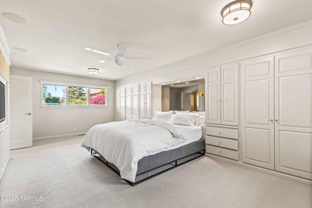 5902 Glacier Way, Yakima, WA 98908 - bedroom with light colored carpet, baseboards, and ceiling fan