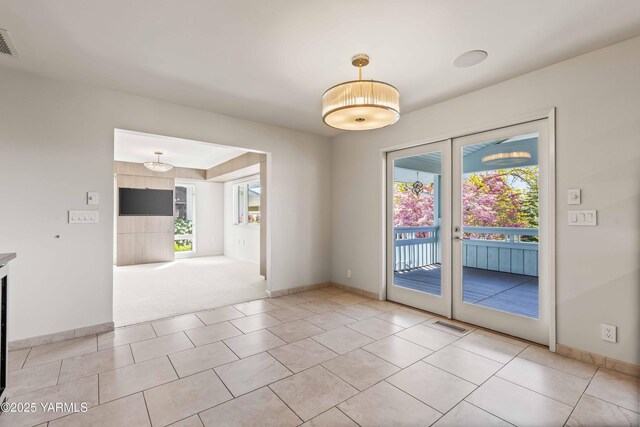 5902 Glacier Way, Yakima, WA 98908 - empty room with healthy amount of natural light, french doors, and baseboards