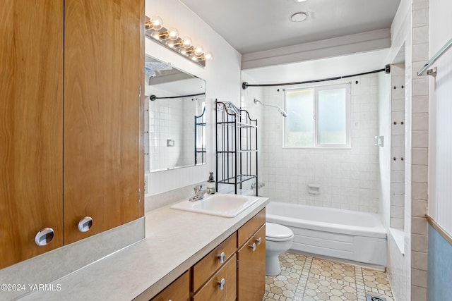 full bathroom with tile patterned flooring, tub / shower combination, vanity, and toilet