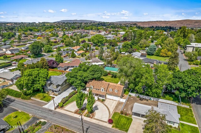 3703 W Chestnut Ave, Yakima, WA 98902 - aerial view of property and surrounding area with nearby suburban area and a mountainous background