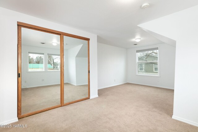 3703 W Chestnut Ave, Yakima, WA 98902 - carpeted empty room featuring healthy amount of natural light, baseboards, and a smoke detector