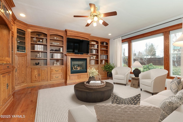 3703 W Chestnut Ave, Yakima, WA 98902 - living area with a glass covered fireplace, ceiling fan, light wood finished floors, and recessed lighting