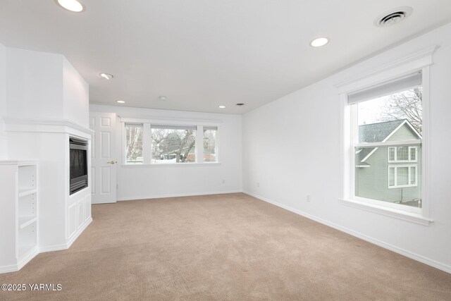 full bath with tile patterned floors, baseboards, a bath, double vanity, and vaulted ceiling