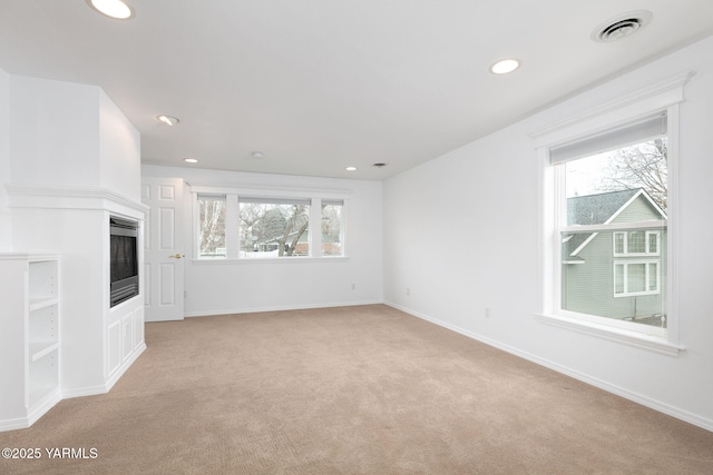 3703 W Chestnut Ave, Yakima, WA 98902 - unfurnished living room featuring light colored carpet, recessed lighting, and baseboards