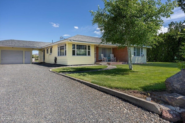 3700 Sheller Rd, Sunnyside, WA 98944 - single story home featuring a garage, gravel driveway, a front yard, and covered porch