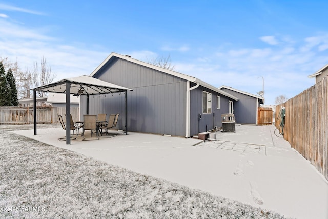 back of property with a patio area and a fenced backyard