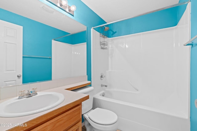 full bathroom with washtub / shower combination, toilet, and vanity