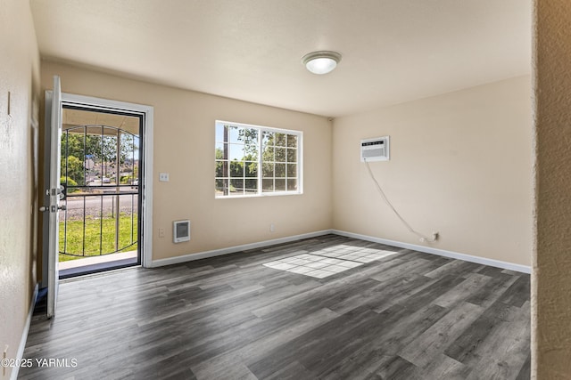 921 N 29th Ave, Yakima, WA 98902 - spare room with an AC wall unit, dark wood finished floors, and heating unit