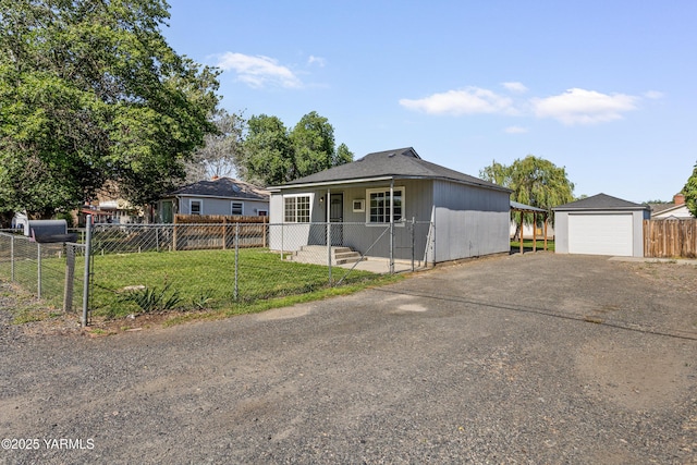 921 N 29th Ave, Yakima, WA 98902 - view of front of property with asphalt driveway, a garage, and an outdoor structure