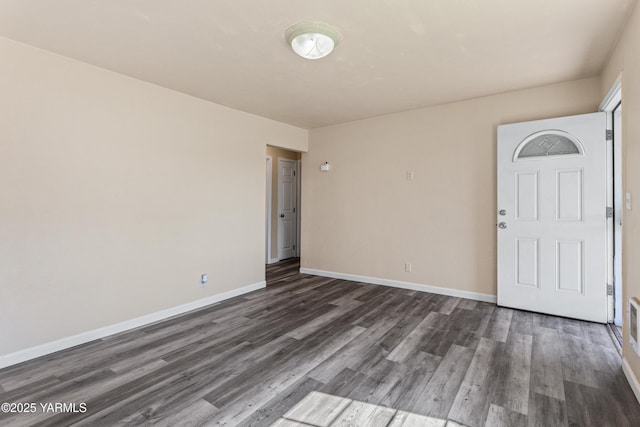 921 N 29th Ave, Yakima, WA 98902 - spare room featuring dark wood-type flooring and baseboards