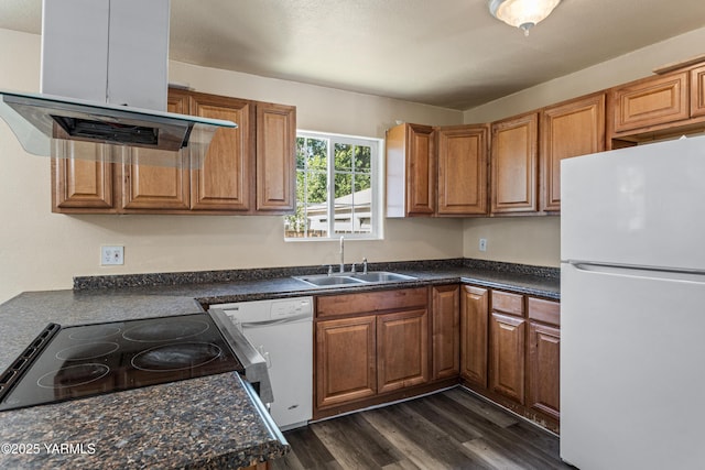921 N 29th Ave, Yakima, WA 98902 - kitchen with white appliances, extractor fan, dark wood finished floors, dark countertops, and brown cabinets