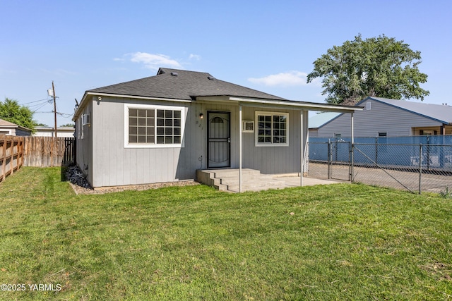 921 N 29th Ave, Yakima, WA 98902 - back of house featuring a fenced backyard, roof with shingles, and a patio