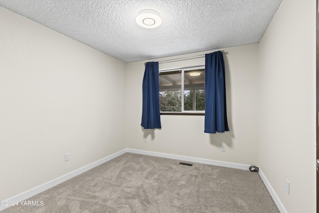 215 S Ridgeway Dr, Yakima, WA 98901 - carpeted empty room featuring a textured ceiling, baseboards, and visible vents