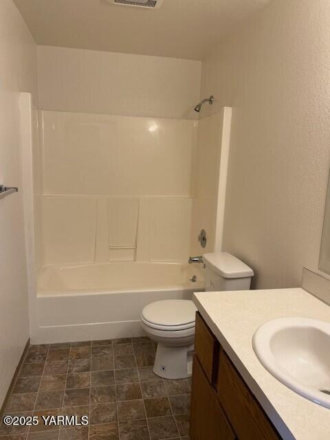 full bathroom featuring visible vents, tub / shower combination, toilet, and vanity