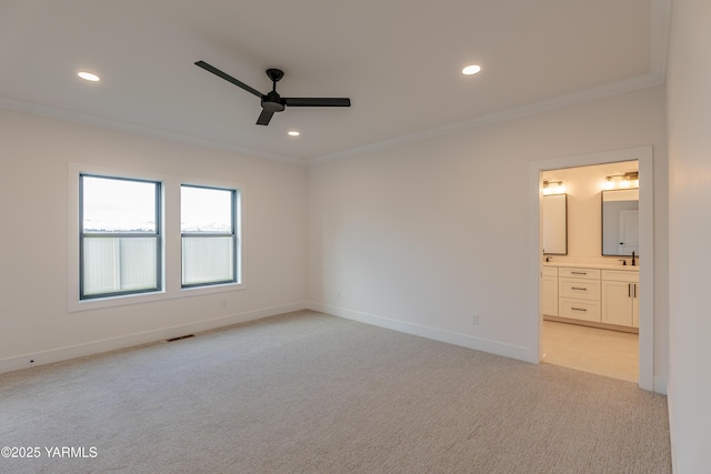 unfurnished bedroom with light carpet, ornamental molding, and recessed lighting