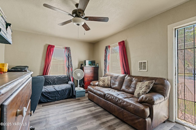 1311 W Mead Ave, Yakima, WA 98902 - living area with wood finished floors, a textured wall, ceiling fan, and a textured ceiling