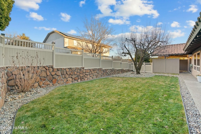 view of yard featuring a fenced backyard