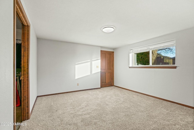 interior space with light colored carpet and baseboards