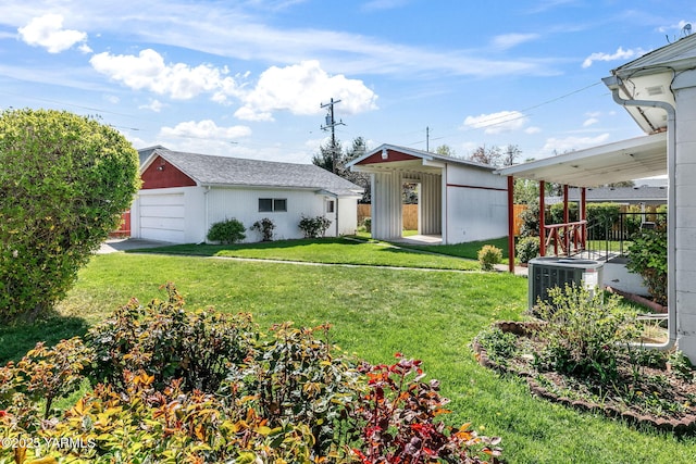 view of front of home with an outdoor structure, a detached garage, central air condition unit, and a front yard