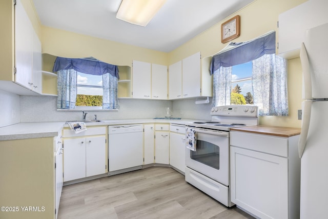 kitchen featuring decorative backsplash, open shelves, white appliances, and light countertops
