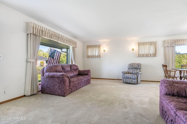 living room with baseboards and carpet flooring