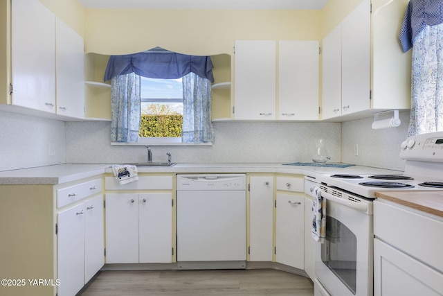 kitchen featuring open shelves, light countertops, white appliances, and tasteful backsplash