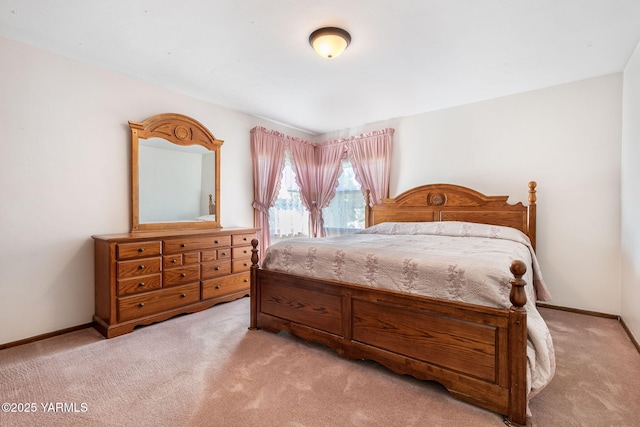 bedroom featuring baseboards and carpet flooring
