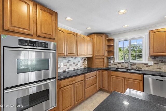 kitchen featuring a sink, stainless steel appliances, crown molding, recessed lighting, and backsplash