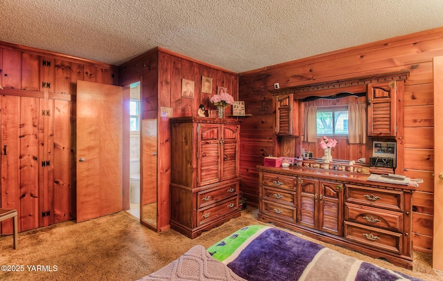 full bathroom with wooden walls, toilet, a textured ceiling, and vanity