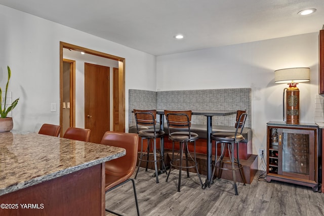 3603 Carol Ave, Yakima, WA 98902 - dining area featuring a dry bar, wood finished floors, recessed lighting, and wine cooler