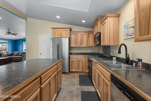 710 Columbus Ave, Moxee, WA 98936 - kitchen with stainless steel appliances, dark countertops, lofted ceiling, light tile patterned floors, and ceiling fan